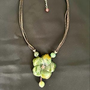 Green and purple stone necklace with lot of detail in design
